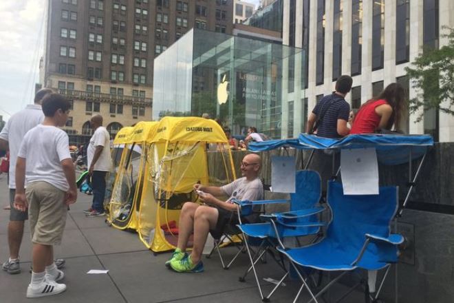 Real camps have grown up in front of some Apple stores.