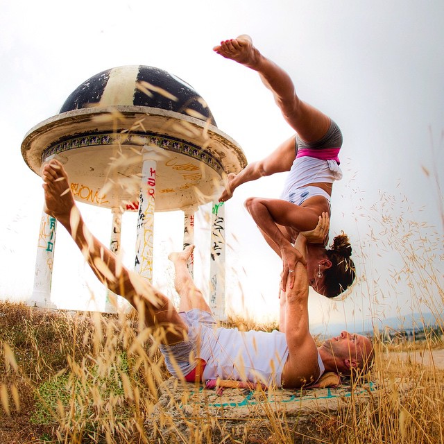 The couple travels the world posing in gravity-defying yoga poses